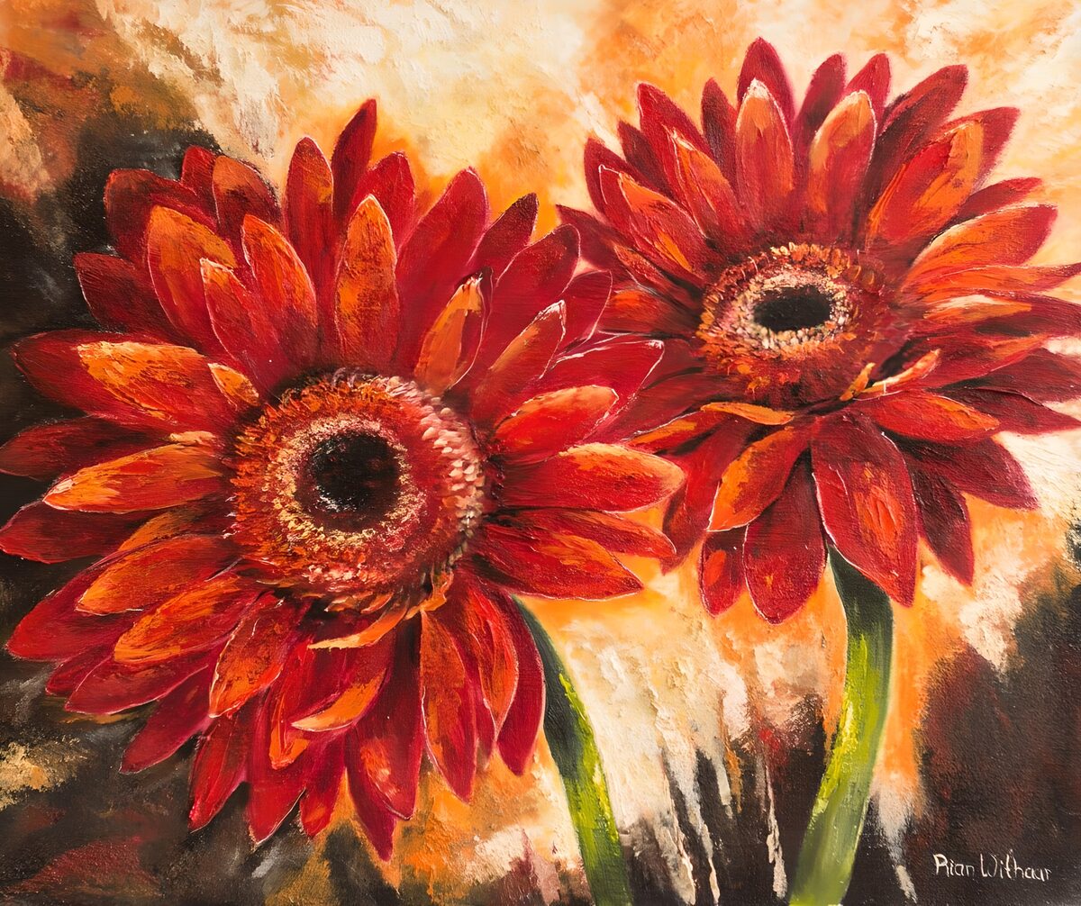 Twee rode gerbera's in warm licht